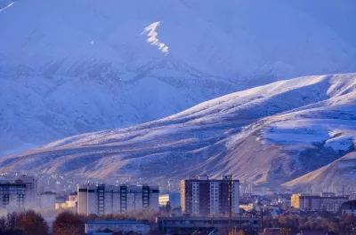 A city against the backdrop of mountains in Kyrgyzstan